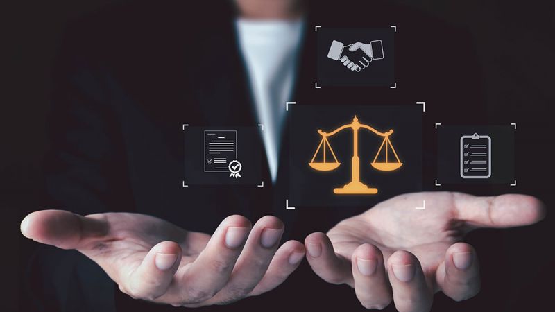 Businessman holding legal scales, contract, handshake, and checklist icons illustrating justice and business agreements.