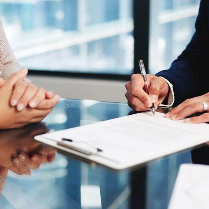 People reviewing documents for wrongful death settlements