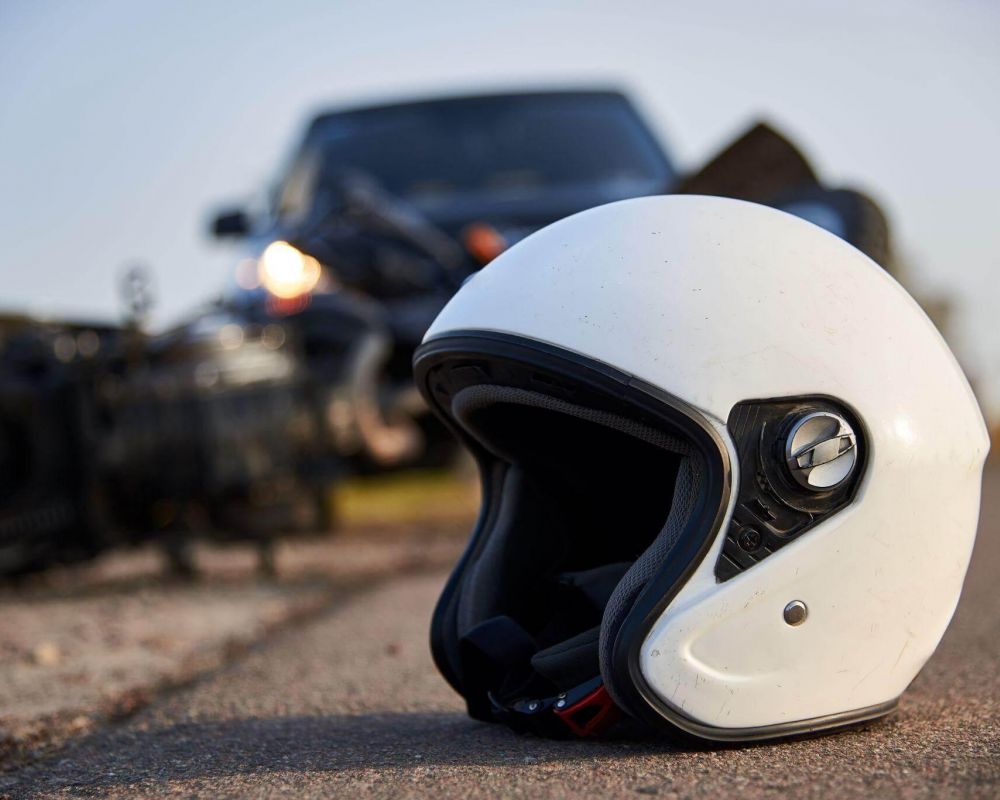 a white helmet sitting on the side of a road