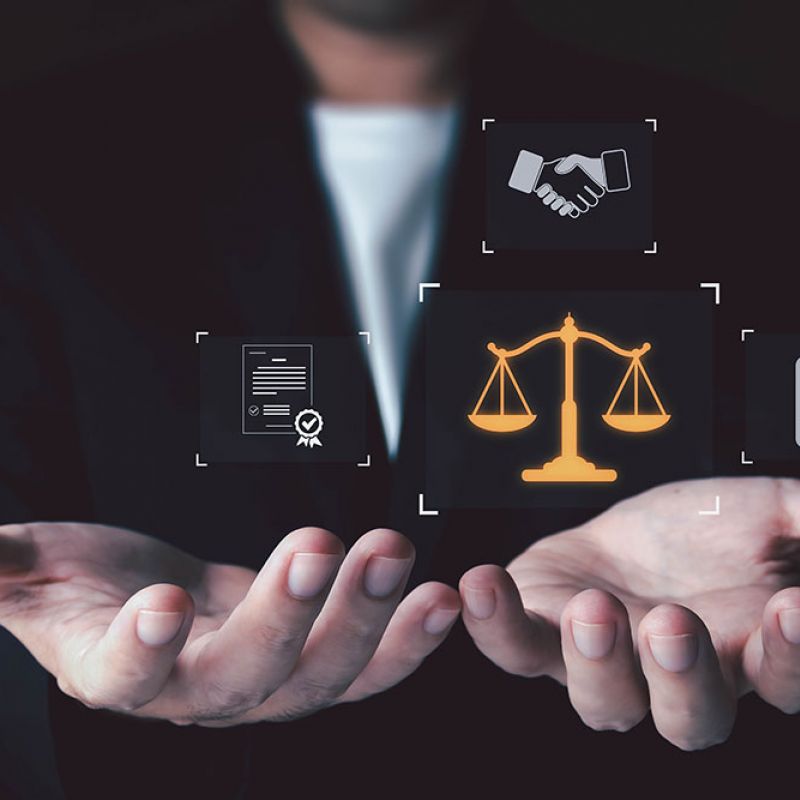 Businessman holding legal scales, contract, handshake, and checklist icons illustrating justice and business agreements.