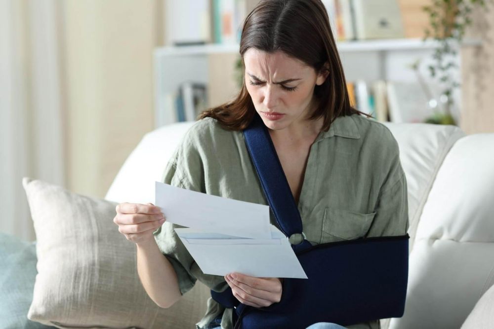 Woman sitting on a couch reviewing an