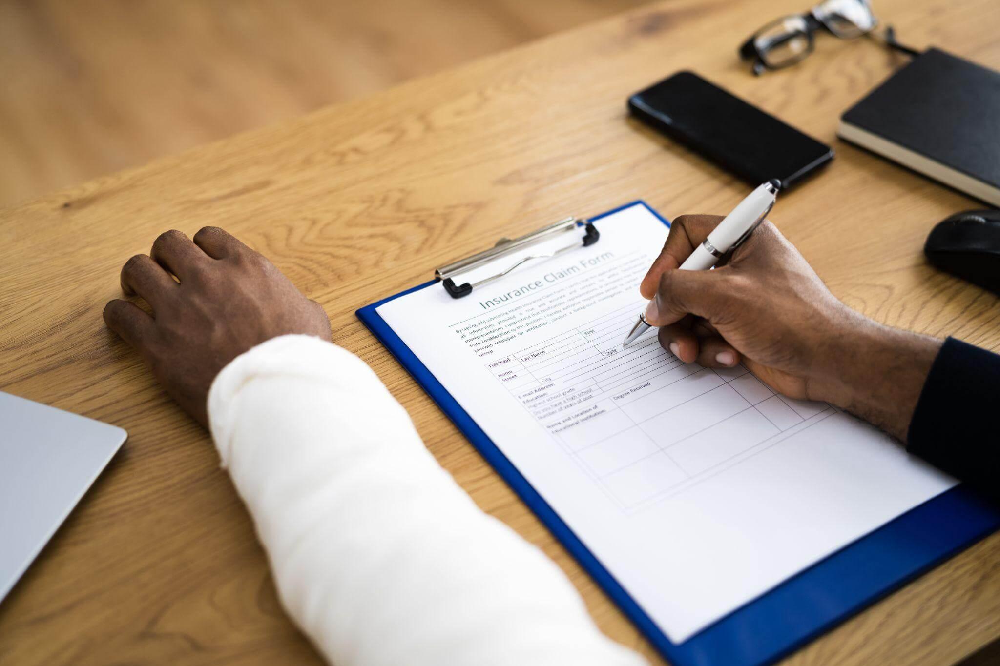 a person sitting at a table with a clipboard and pen